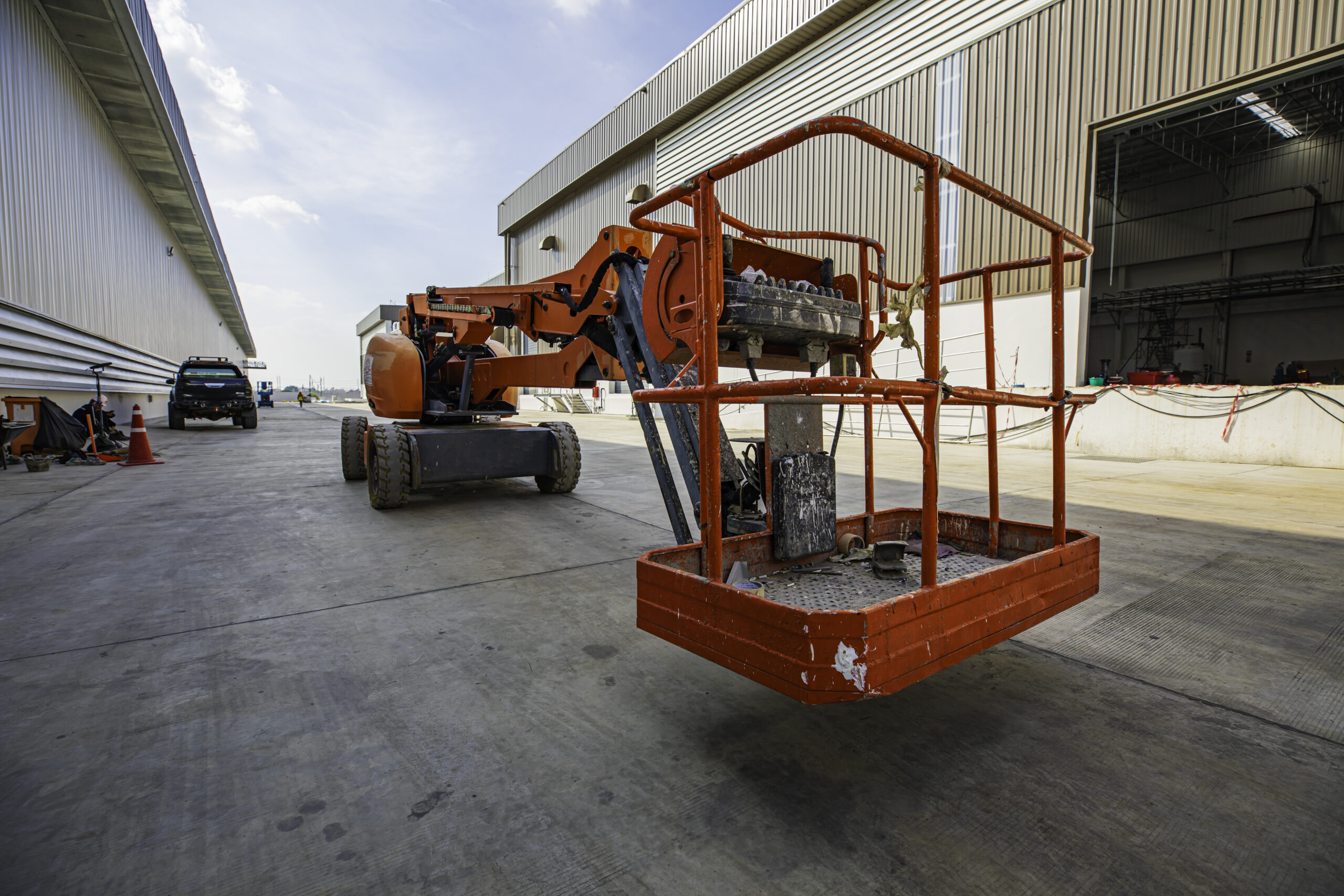 Workers working on the construction site of the new factory industry for boom lift roof